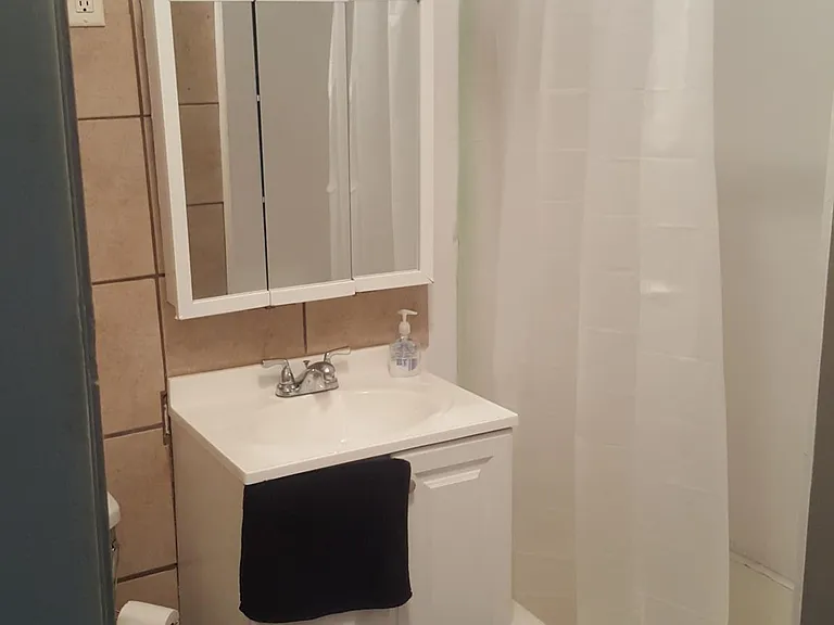 Upstairs bathroom. Stool, vanity/sink, shower/tub. Has exhaust fan.