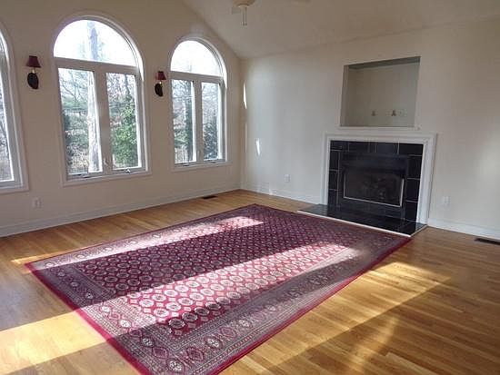 Sun room with walk-out to deck and patio, gas fireplace, vaulted-ceiling