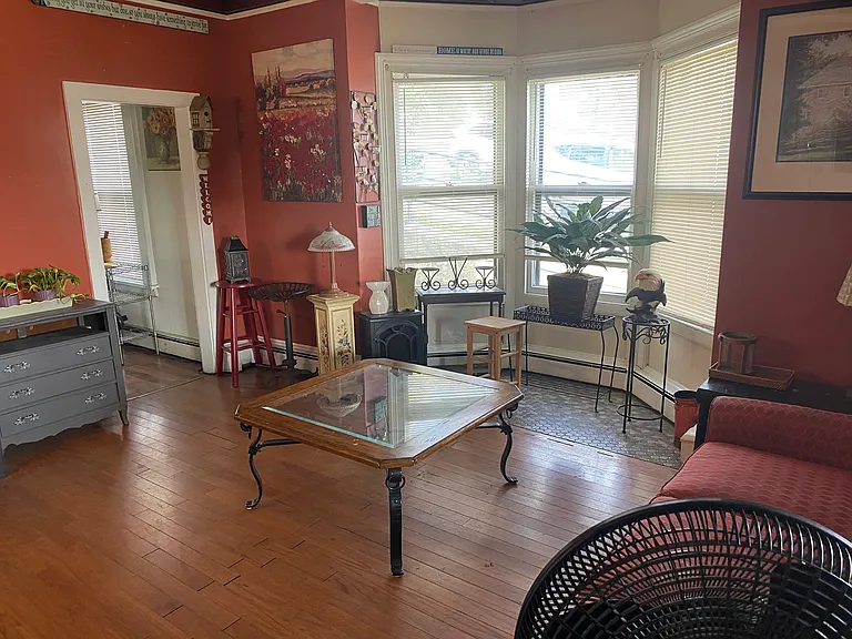 Living Room - 3 Corner Windows. Can accommodate dining table.