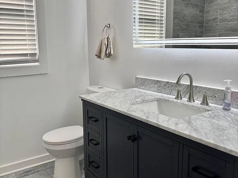 Room 2 bathroom with vanity mirror