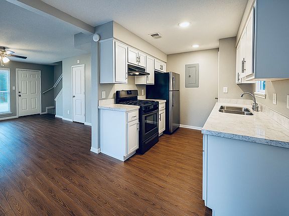 Modern kitchen with ample cabinet space and sleek finishes_functional and stylish for home cooking.