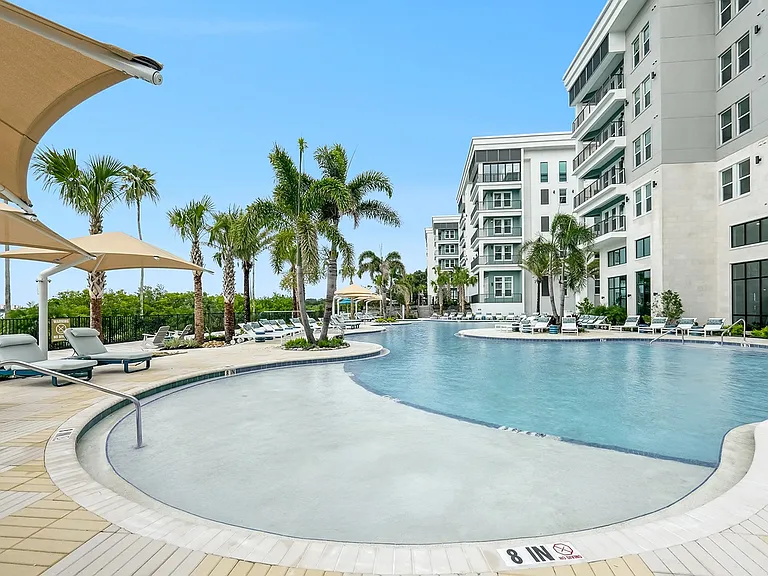 Resort-Style Pool with Sun Shelf and Grilling