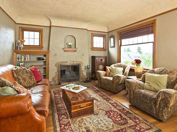 Coved ceilings, wood burning fireplace and original moldings define old world charm!