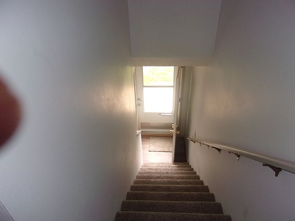 stairs going down to front door or living room