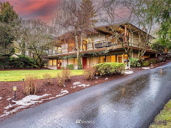 Gently sloping driveway leads to the main entrance where you feel on top of the world.