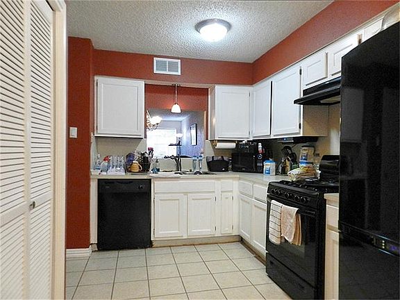 Kitchen with pass-thru to dining.