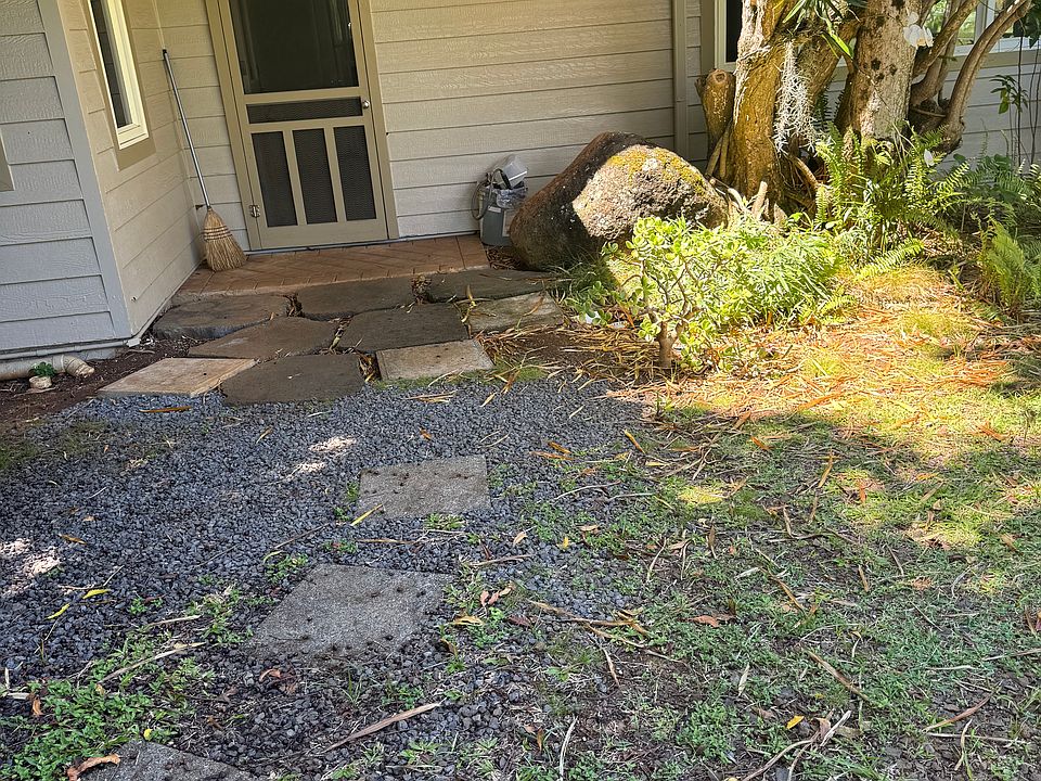 outdoor entrance surrounded by beautiful greenery