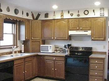 Oak cabinets in a neat & clean kitchen...major appliances