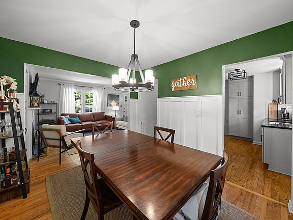 Hardwood floors throughout the home and a great flow between all the living space. Opening to the left of the "gather" sign is the entry to the fully finished basement.