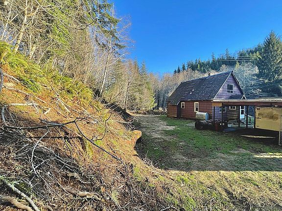Property goes up hillside.