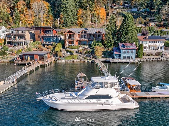 Low bank with 110" feet of waterfront. Shared dock with deep water moorage.