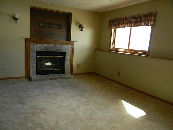 Lower family room with wood burning fireplace