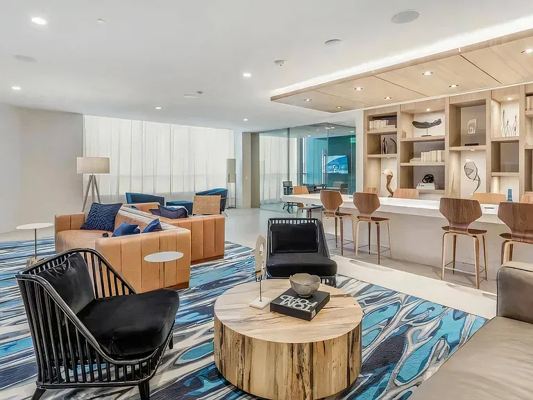 Modern Indoor Clubhouse Featuring Social Lounge and Work Table