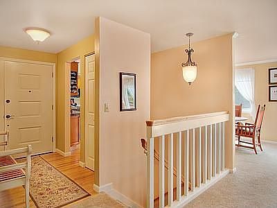Bright interior with hardwoods in entry.