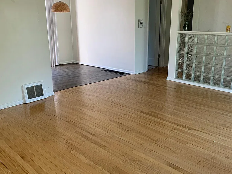Bright and sunny living room and dining room that leads to backyard and bedrooms