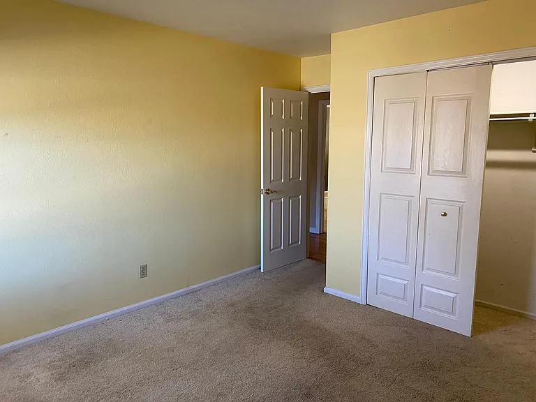 Upstairs bedroom #1 with according door closet.