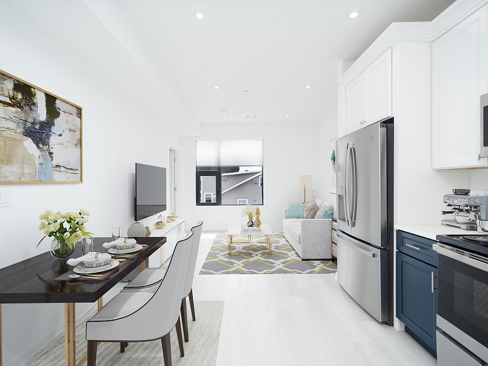 Sleek kitchen and comfortable living and dining space