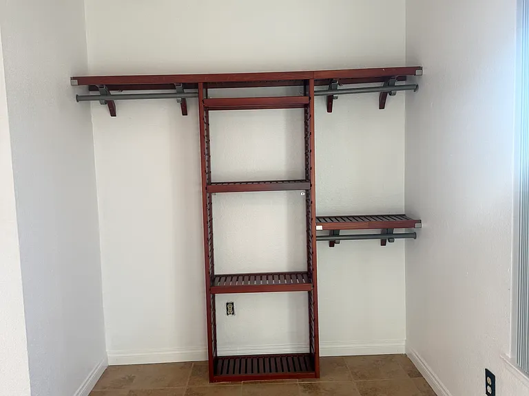Closet in secondary bedroom