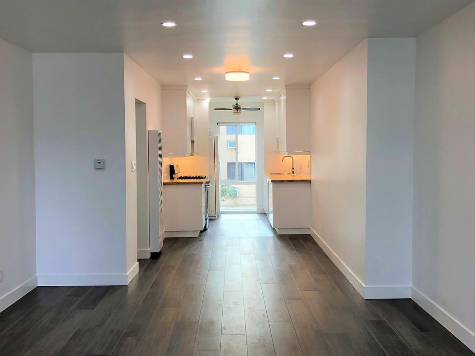 Welcome! This remarkable unit opens to a stunning sun-filled "Great Room".
