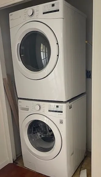 In-unit stackable washer dryer is adjacent to dining nook. Hooks on the interior make great storage.