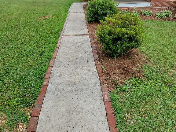 Sidewalk lined with bricks
