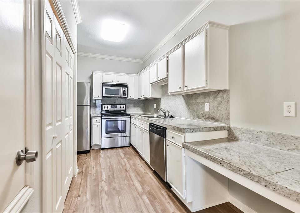 Nicely renovated kitchen with tile granite and stainless steel appliances