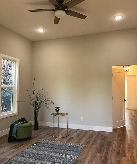 10 foot ceiling, spacious living room with ample natural light through two 5.5 foot tall windows. Wood laminate flooring in living room, both bedrooms, hall and sunroom. All new textured walls, doors, dual pane windows. Decorator two tone paint.