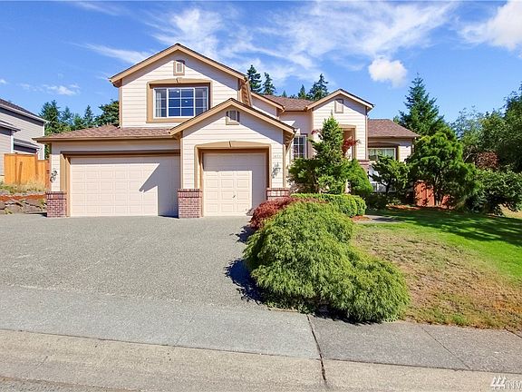 Three car garage offers plenty of options for parking and/or storage.