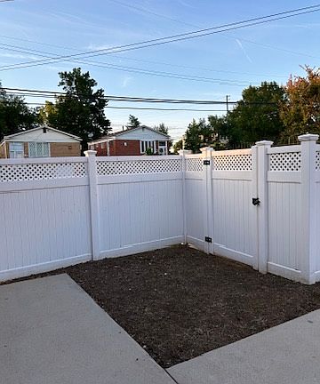 Driveway and gate to backyard