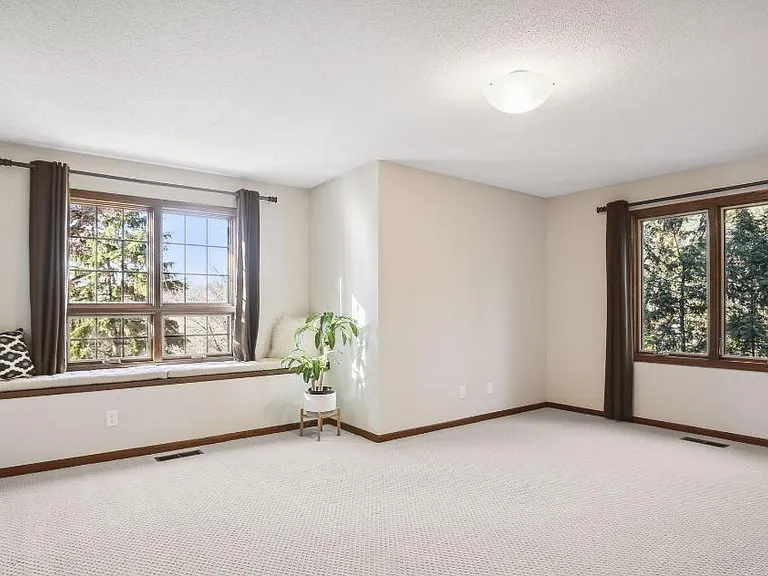 Huge guest bedroom with lake views, and reading bench
