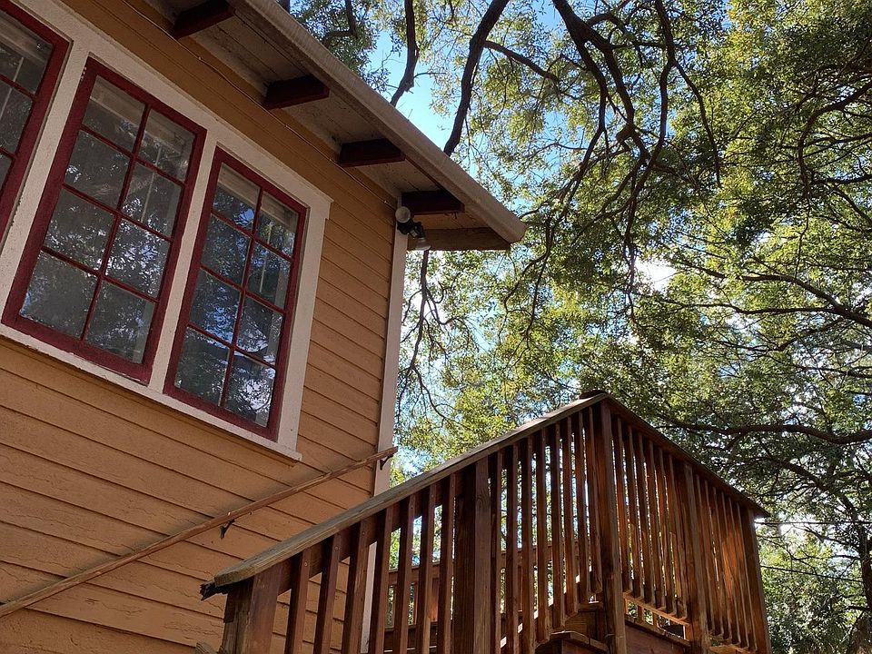 Steps leading up to this TREEmendous second floor apartment with a private balcony overlooking the majestic trees in Historic Roser Park