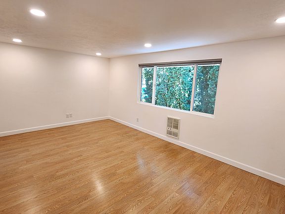 Large Open living room with can lighting.