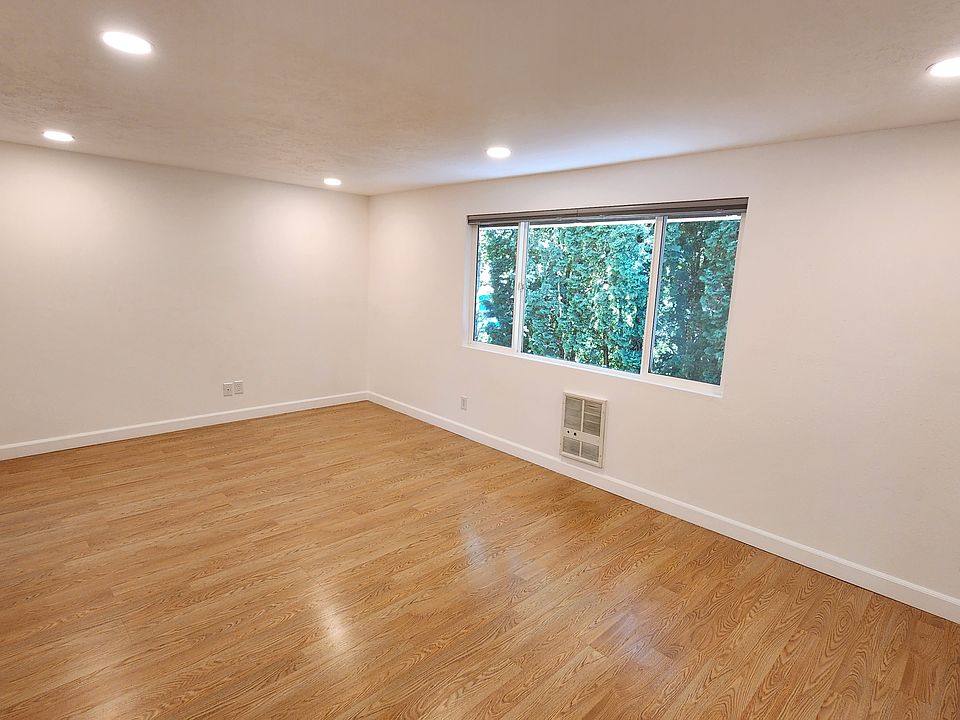 Large Open living room with can lighting.