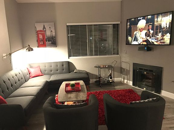 living area with 60 in TV