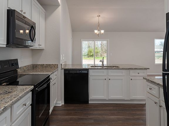 The beautiful kitchen includes all Whirlpool brand appliances