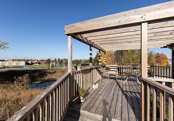 Deck, pond, school across.