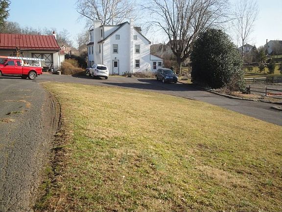 home and guest house sit 200 ft back from street. Long circular drive