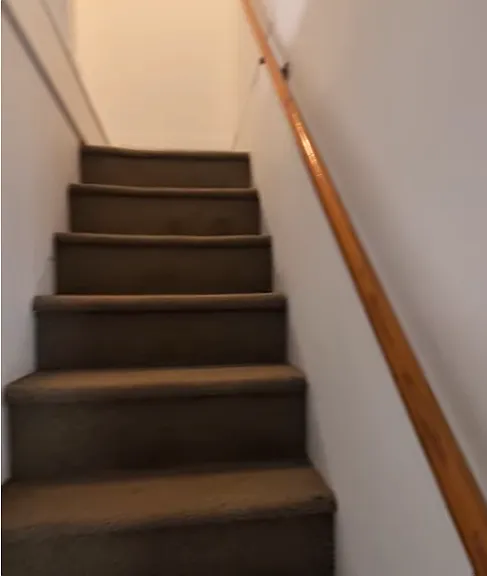 Staircase to 2nd floor where there are 3 bedrooms.