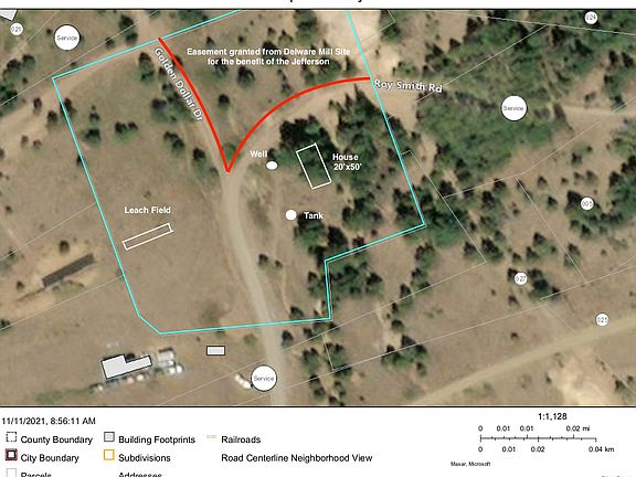The home is set against the trees, but the balance of the property is a flat and usable meadow.