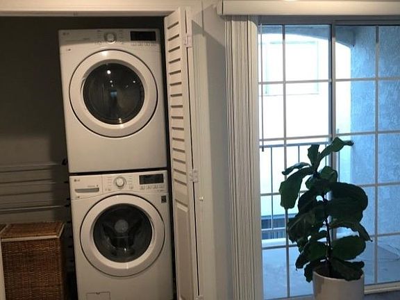 In unit washer dryer and one of two balconies on second floor