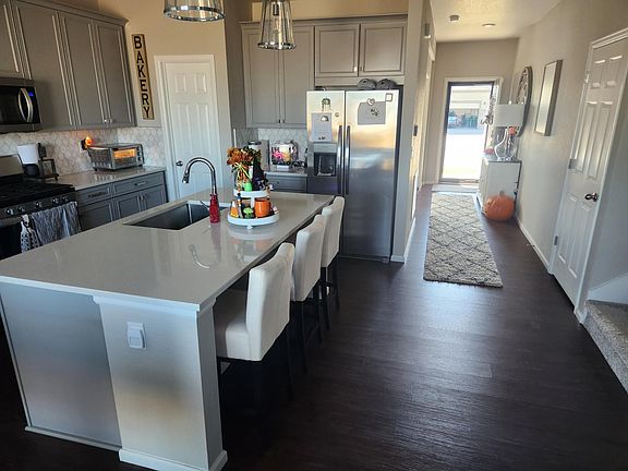 Another view of the kitchen and entry hallway.