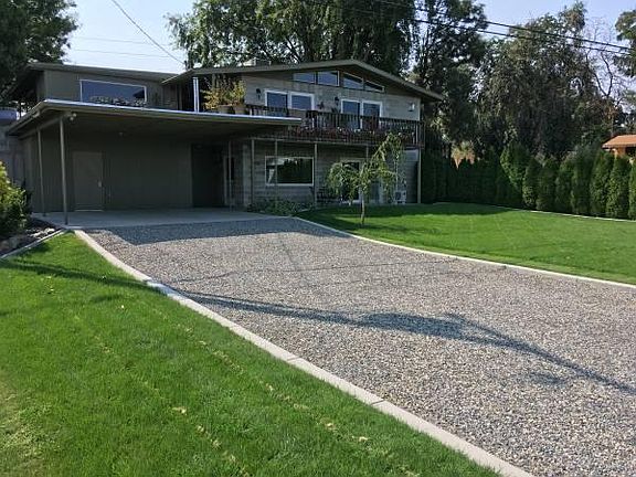 View of the front with patio and carport