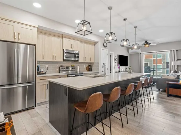 370 Harvest Hills Cmn E #205, Calgary, AB T3K 2M8
