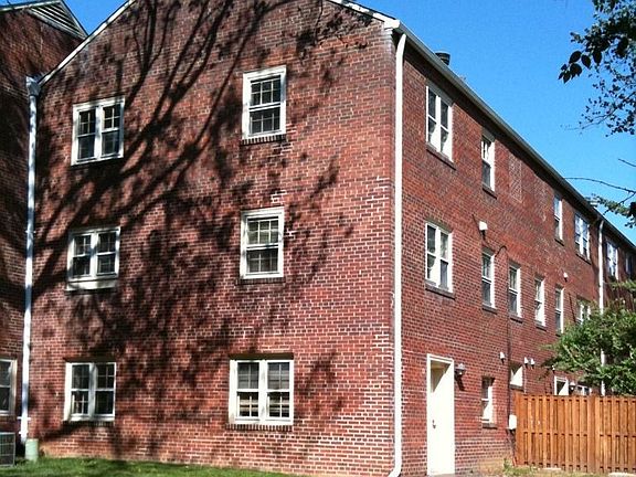 Corner unit has three floors of sun-drenched exposure on two sides