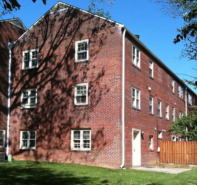 Corner unit has three floors of sun-drenched exposure on two sides