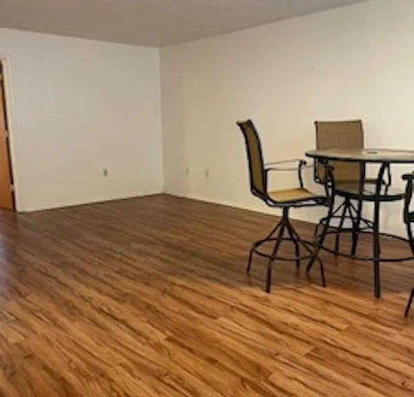 Large living room, dining combination. Easy to care for floors. View from front door.