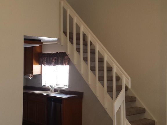 Kitchen and stairway to 2nd bedroom loft