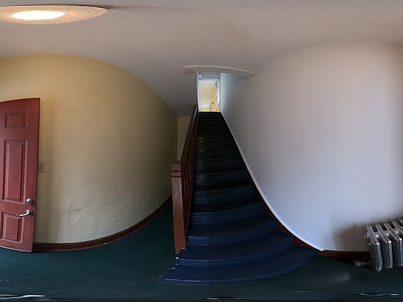 At the entrance on the left is the hallway to the laundry. On the right, the stairs to whole second floor.