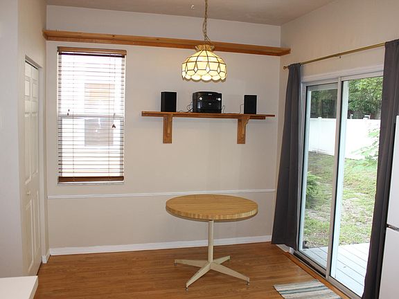 Light, bright dining room with sliders to deck. Pantry on left.