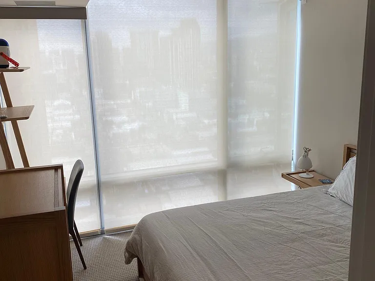 Motorized shades in the bedroom and living room